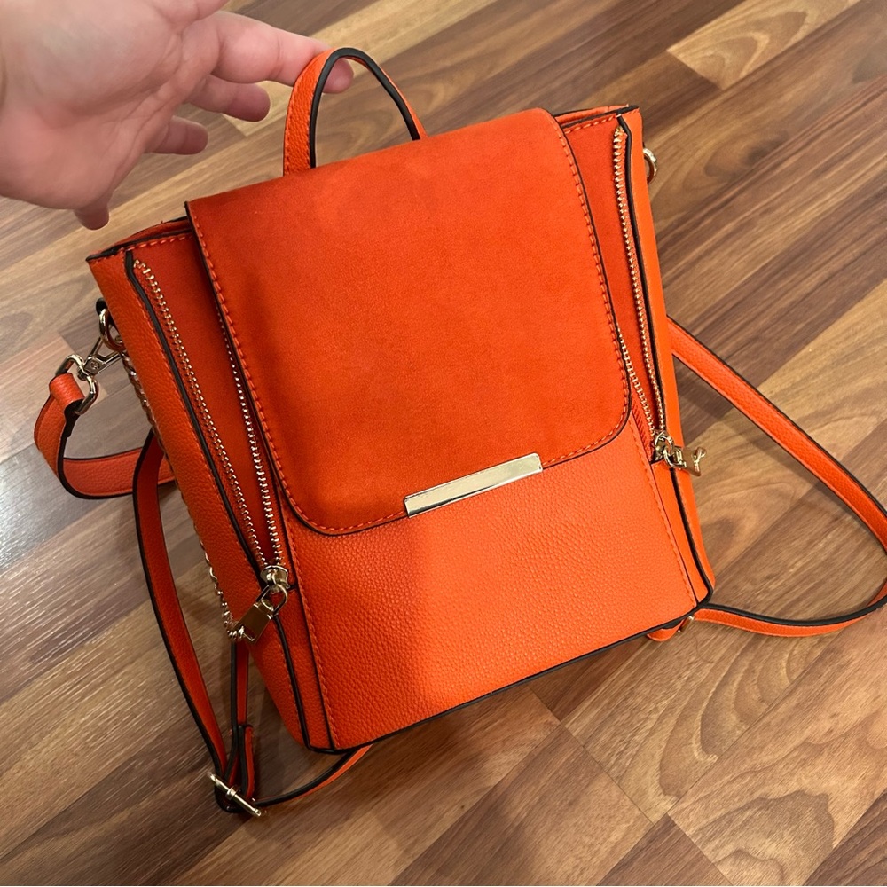 Beautiful bright Orange mini backpack by Call it Spring